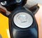 Motorcycle fuel oil tank cap on cement floor background closeup