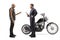 Motorcycle mechanic talking to a biker with a chopper