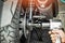 Motorcycle Mechanic using a air impact wrench and socket on a