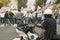 A motorcycle policeman looks at protesters against George W. Bush and the Iraq War at an anti-Iraq War protest march in Santa Barb