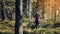 motorcycle racer on an enduro sports motorcycle rides in the forest in an off-road race