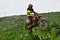 Motorcycle racers In rainy weather and a muddy track