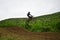 Motorcycle racers In rainy weather and a muddy track