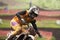 Motorcycle racing in the rain. A fragment of a motorcycle racer in the mud, moving at high speed. Selective focus. Copy space