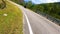 Motorcycle ridding in himalayan mountain twisty road at morning from low angle