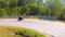 Motorcycle ridding in himalayan mountain twisty road at morning from low angle