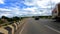 Motorcycle ridding on tarmac clip road with amazing blue sky and cloud patch clip is shot while driving motorcycle showing the