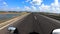 Motorcycle ridding on tarmac road with amazing blue sky and cloud patch