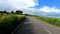 Motorcycle ridding at twisty mountain road with lush green forests