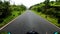 Motorcycle ridding at twisty mountain road with lush green forests