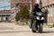 Motorcycle rider with complete black outfit