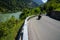 Motorcycle rider enjoys a ride on the curving mountain roads in the idyllic Swiss Alps