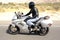 A motorcycle rider races on a highway in the desert surrounding Palm Springs, California.