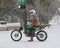 Motorcycle riding in a snowstorm down King Street