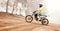 Motorcycle, speed and uphill with a sports man on space in the forest for dirt biking. Bike, fitness and power with a