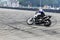Motorcycle stunt drifting on dirty asphalt