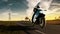 Motorcycle tour on the country road with imposing sky and sunset