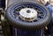 Motorcycle wheel. Rim of a spoke on a background of a blue motorcycle retro techno background