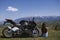 A motorcycle woman looks at nature