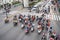 Motorcycles and cars stopped at a red light waiting for the green light at Ratchaprasong intersection