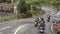 Motorcycles with passengers restarting after stopping for the train to pass, Hai Van Pass, Vietnam