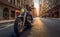 A motorcyclist on a chopper motorcycle rides down a New York street in the evening light