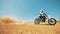 Motorcyclist is driving his bike through dust and sand in slow motion