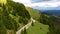 Motorcyclist driving his motorbike on the mountain forest road in the country side. A young man riding a motorbike on a countrysid