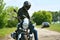 Motorcyclist in helmet and leather jacket sits on his motorcycle