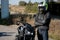 The motorcyclist in helmet on a motorcycle. Motorcyclist stands on the road