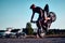 Motorcyclist making doing a difficult and dangerous stunt on his motorbike