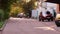 Motorcyclist on a moped rides along the road. A man in a helmet drives motorbike