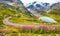 Motorcyclist on mountain pass road in the Alps