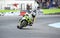 Motorcyclist overtaking another one on a bend during motorcycle racing