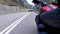 Motorcyclist Rides along on the Scenic Mountain Curve Road. Side view. POV.