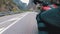 Motorcyclist Rides along on the Scenic Mountain Curve Road. Side view. POV.