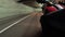Motorcyclist Rides along on the Scenic Mountain Curve Road in Tunnel. Side view. POV.