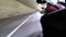 Motorcyclist Rides along on the Scenic Mountain Curve Road in Tunnel. Side view. POV.