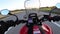 Motorcyclist Rides on the Autobahn at High Speed. View from behind the Wheel