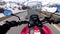 Motorcyclist Rides on a Beautiful Landscape Snowy Mountain Road near Swiss Alps. Switzerland.