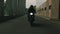 Motorcyclist rides on an empty city road