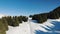 Motorcyclist rides high in the mountains in winter