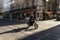 Motorcyclist speeding along a city street