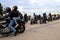 Motorcyclists on Cool Motorbikes, in helmets and leather jackets, open the motorcycle season, Motorcycling in Motorcycle Racing