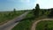 Motorcyclists ride on countryside road. Drone view moto race on racing track