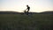 Motorcyclists riding on motorbikes through field against sunset. Friends having active rest outdoor driving powerful