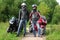 Motorcyclists standing near bikes