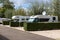 Motorhome campers parked on hardstanding in a camping camp site