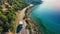 Motorhome driving on scenic coastal road by the sea in summer, travel and vacation concept