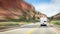 Motorhome going On Road with Background Of Mountains with motion blur effect